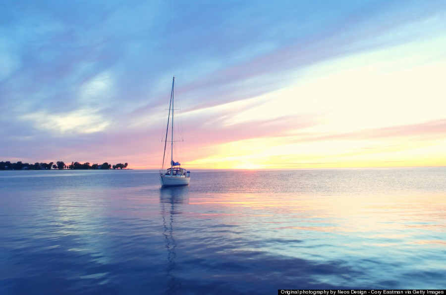 Peaceful sailboat at sunset